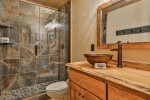 Upper level shared bathroom with walk-in shower 
